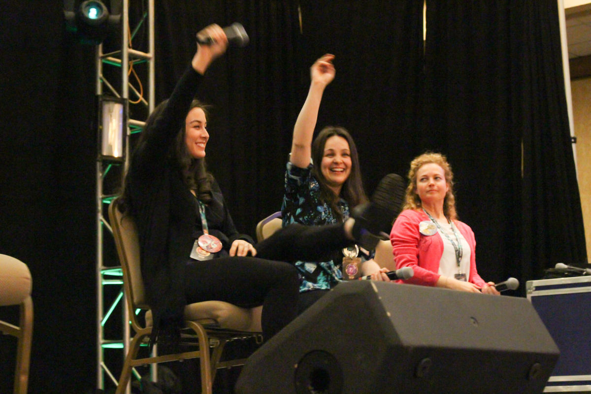 A panel of people speaking on stage.